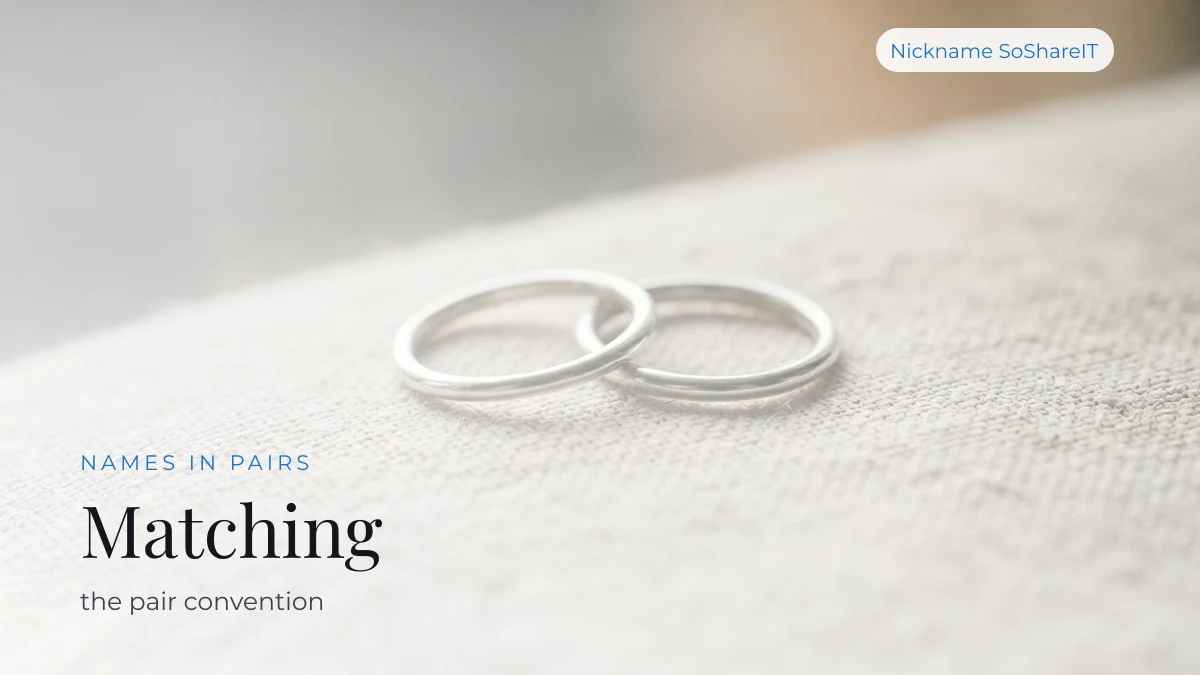 Two thin silver rings on pale linen, illustrating matching soulmate name pairs